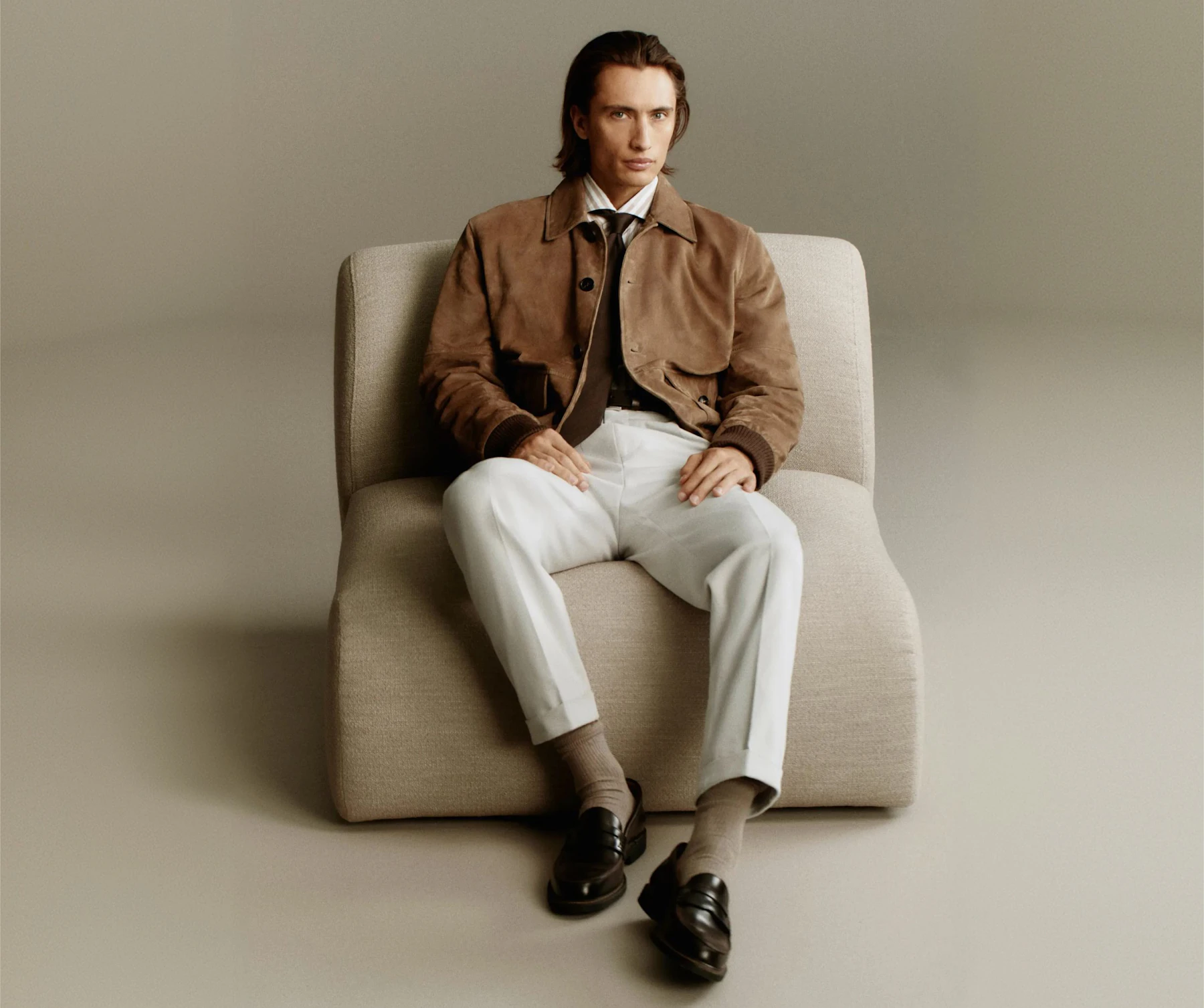 Windsor men leather jacket in brown with white trousers and dark brown loafers