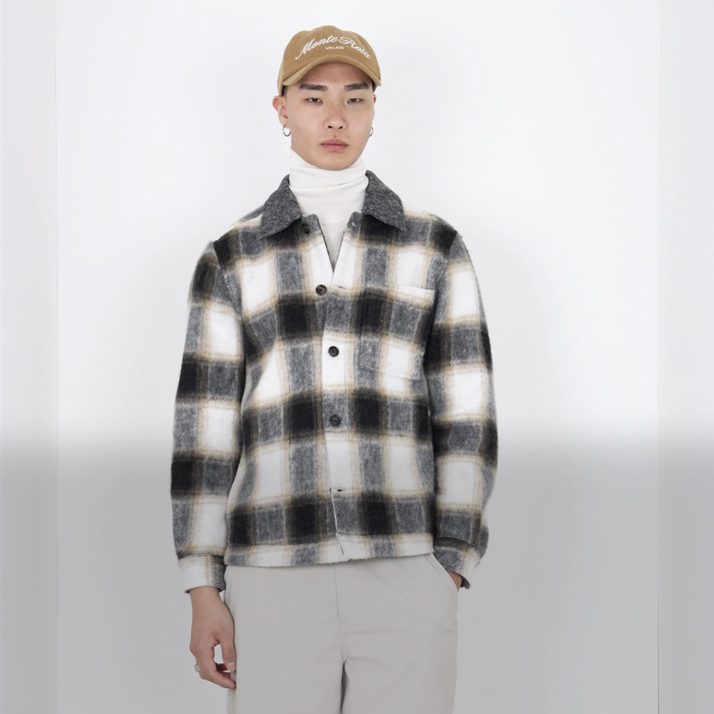 Man with white-grey-black checked overshirt