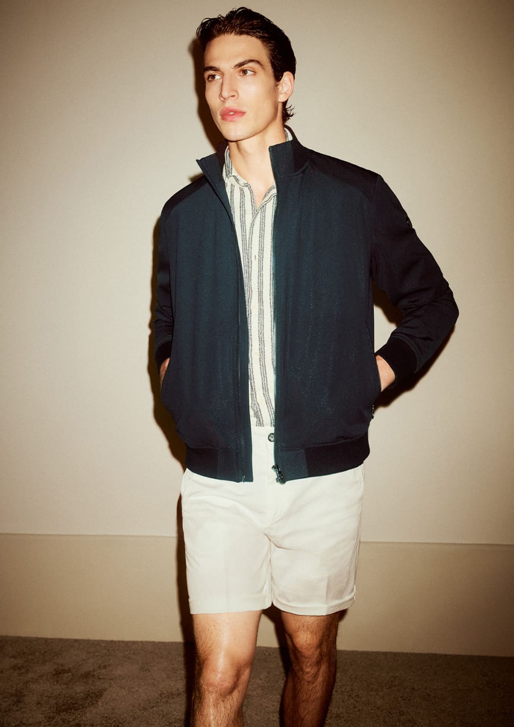 joop men's bomber jacket in navy with green and white striped shirt and shorts in white