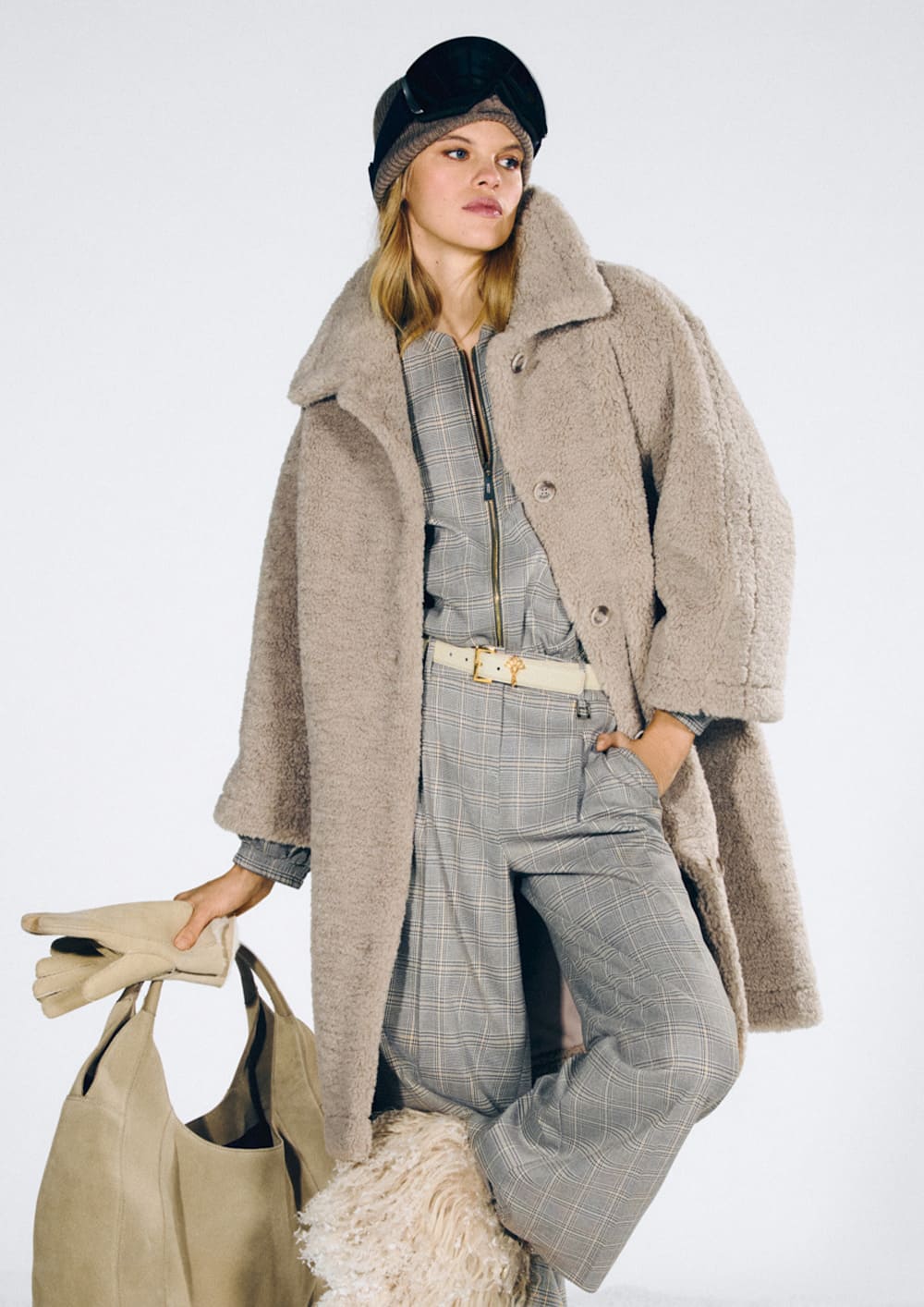 Woman in a Joop teddy coat in beige with a gray plaid matching set
