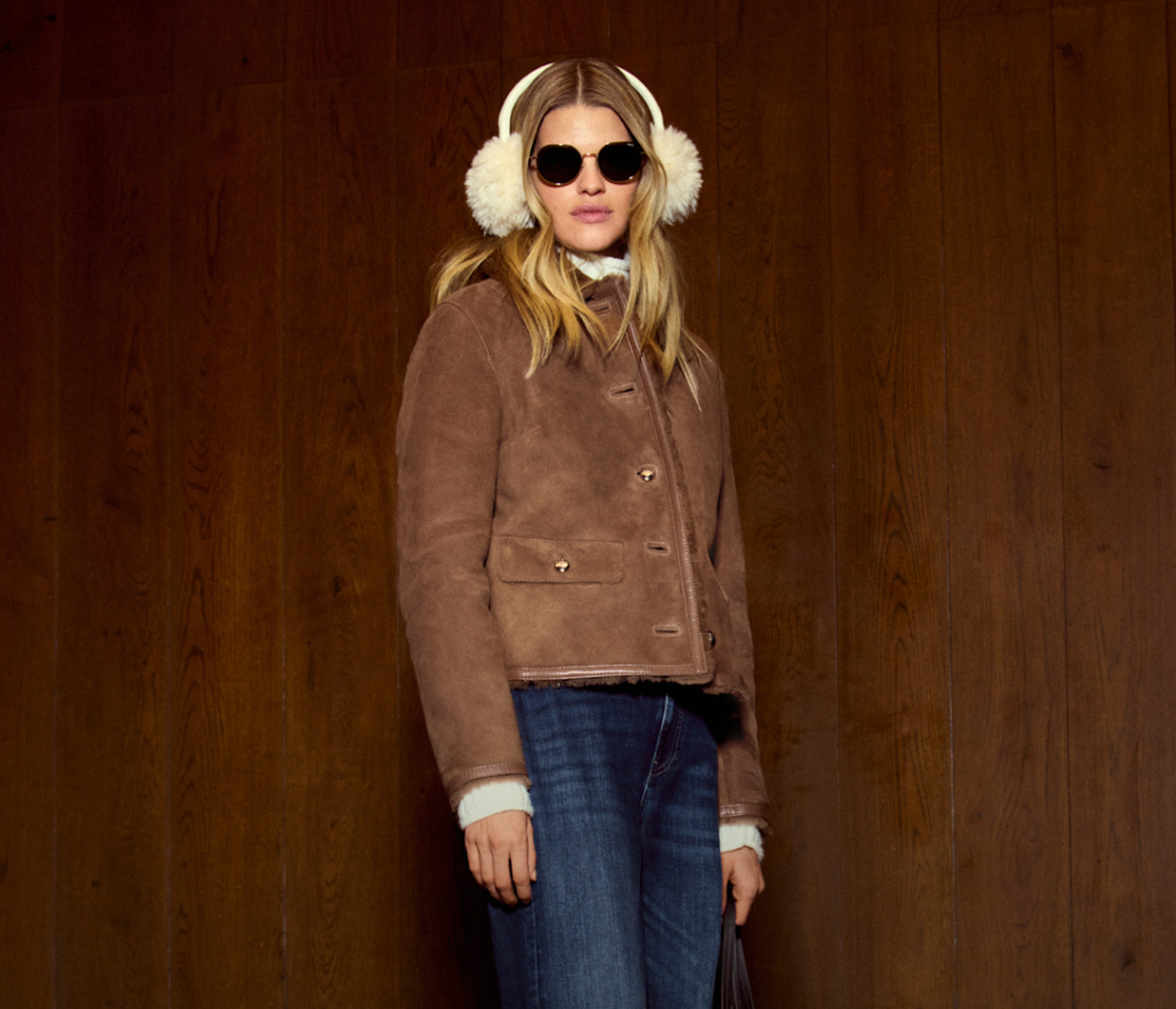 Joop woman in a brown suede jacket and jeans
