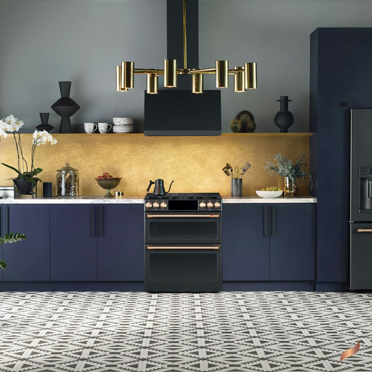 Matte black range in kitchen with navy cabinets