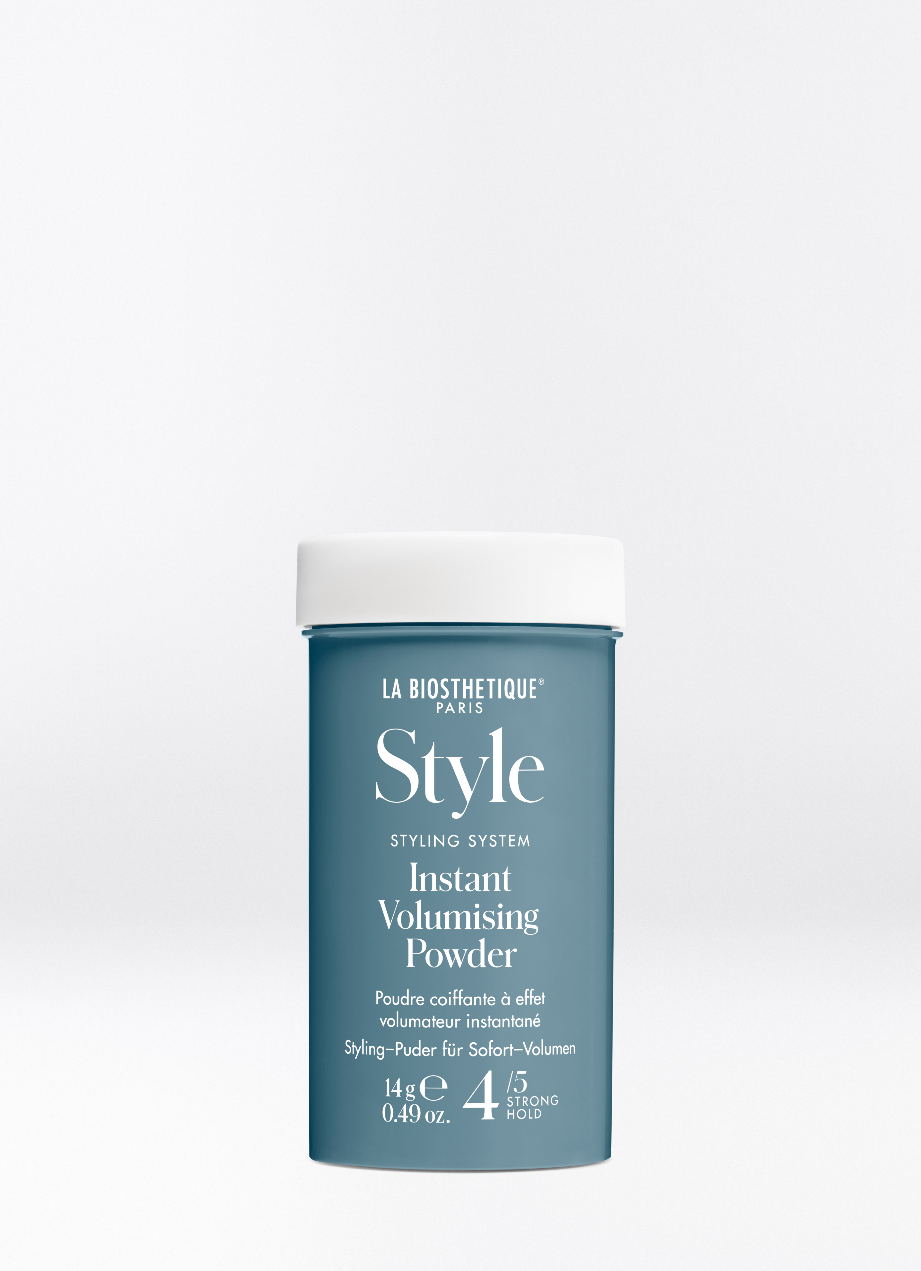 Petrolblaue Dose mit Schraubverschluss des Instant Volumising Powder auf hellgrauem Hintergrund.